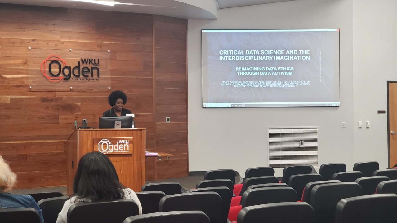 Renée Cummings giving a presentation.