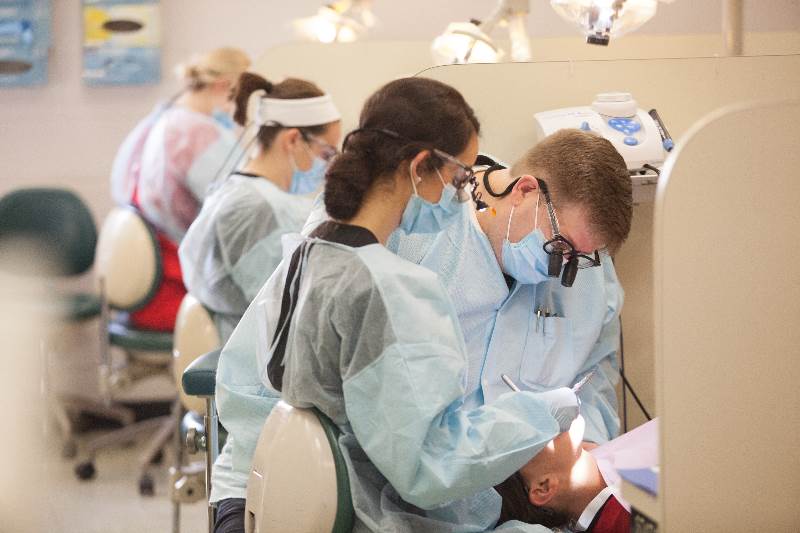 Dr. Terry Dean works alongside a student in the Dental Hygiene clinic.