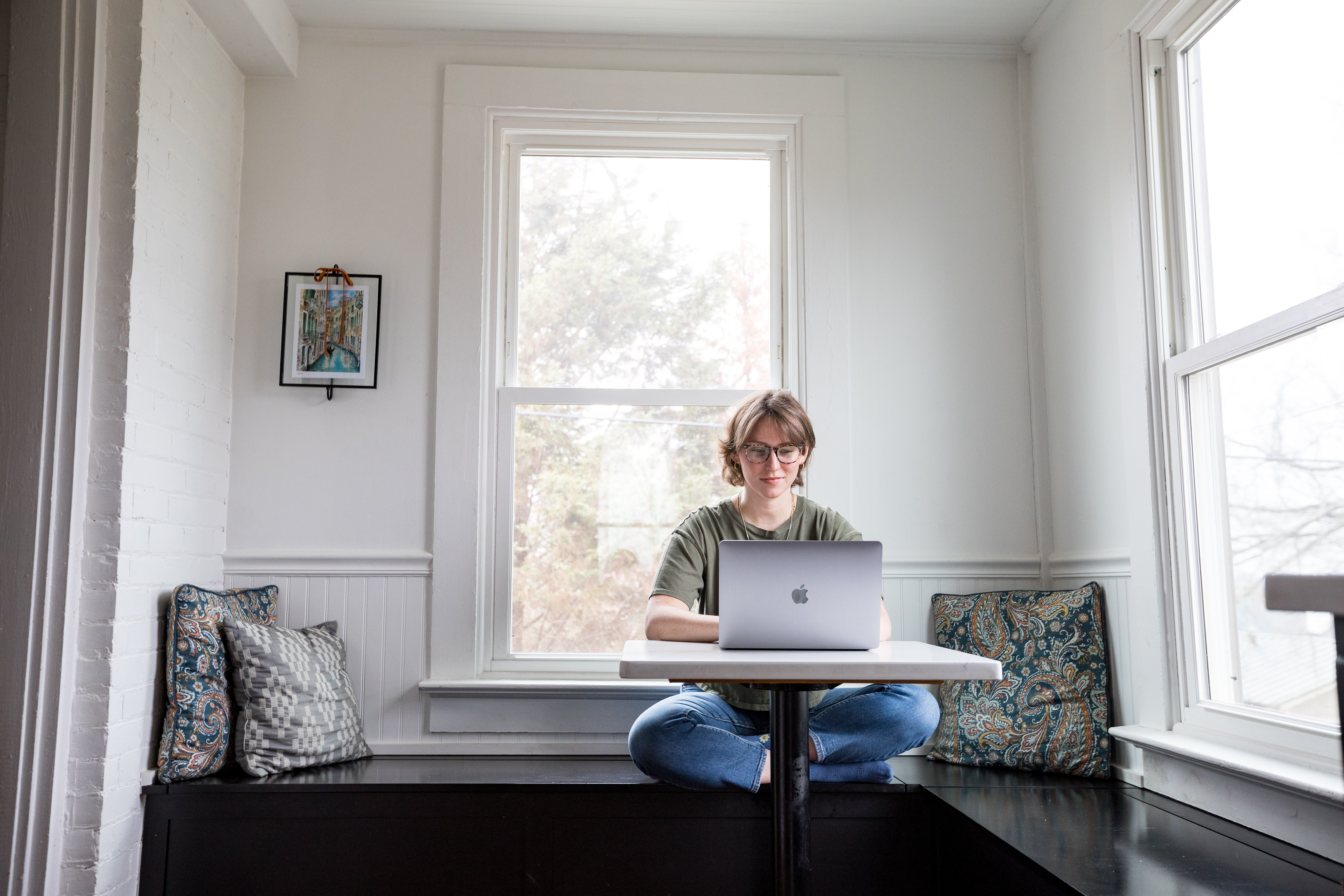An online student works on a laptop.