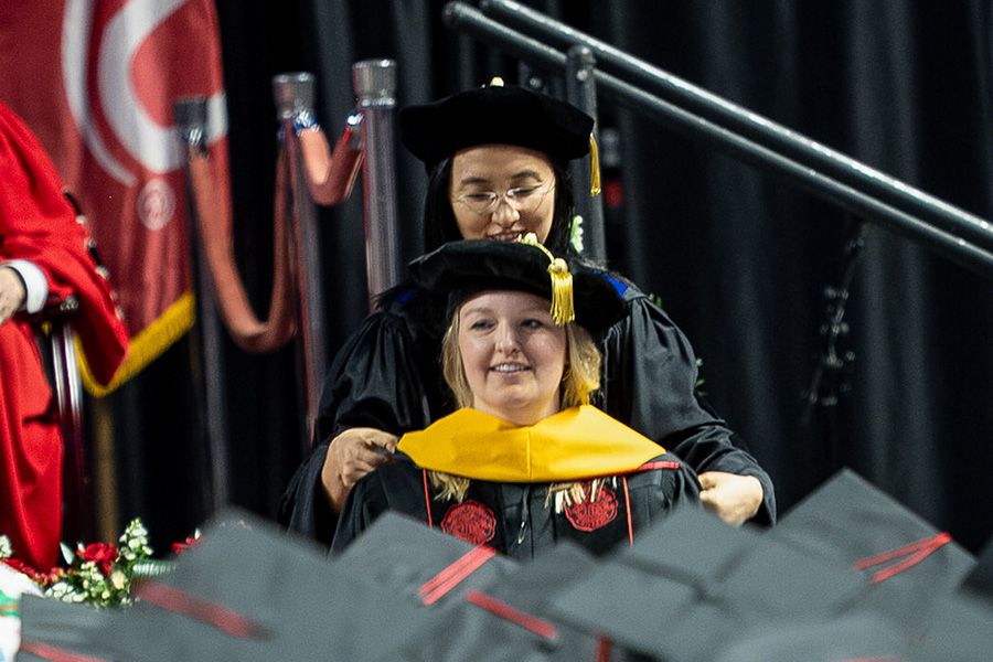 A WKU PsyD student during her hooding ceremony.