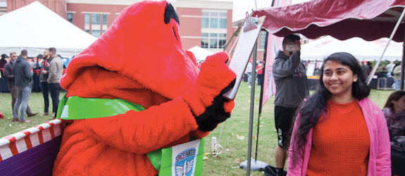 Big Red signing the petition