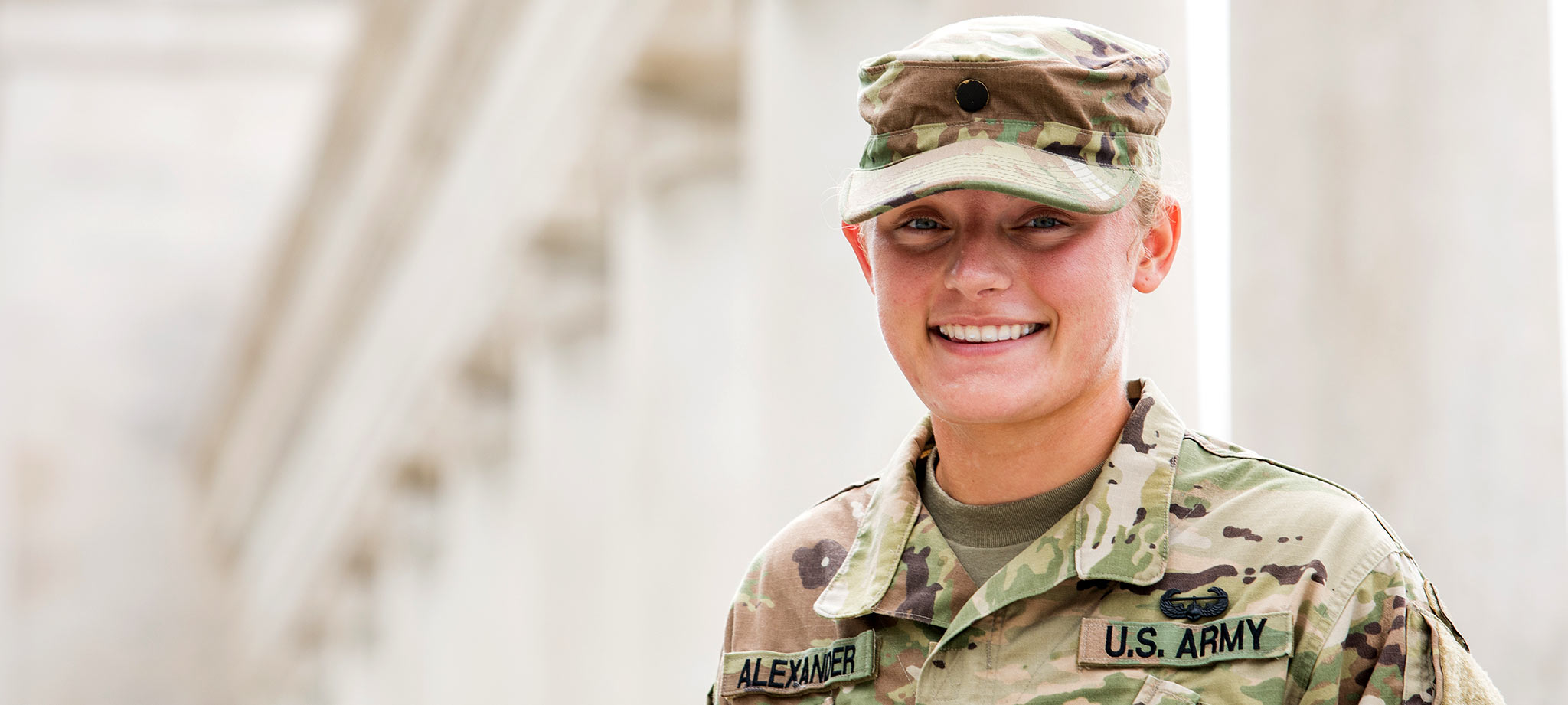 Student veteran posing in front of WKUs colonnade